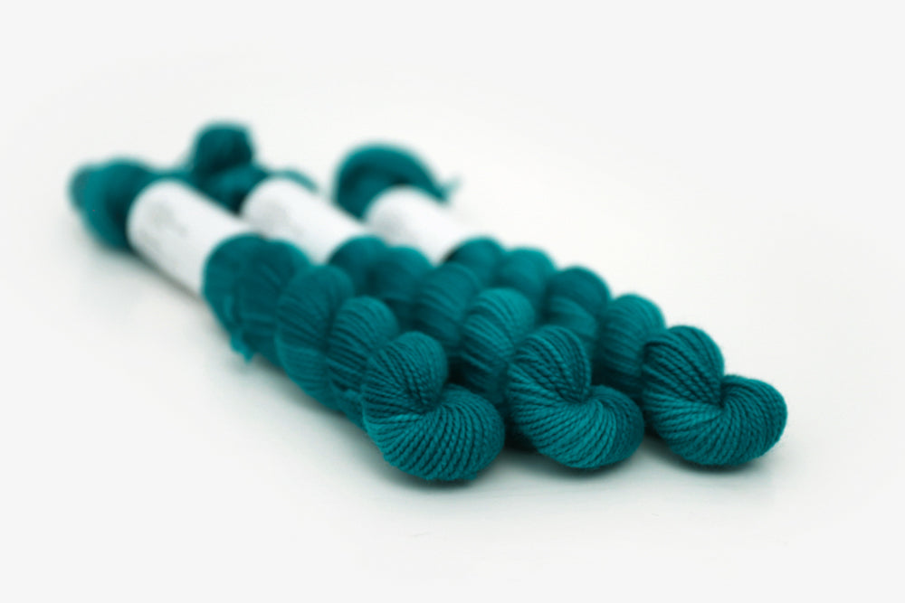 semisolid hand dyed blue green teal merino sock mini yarn