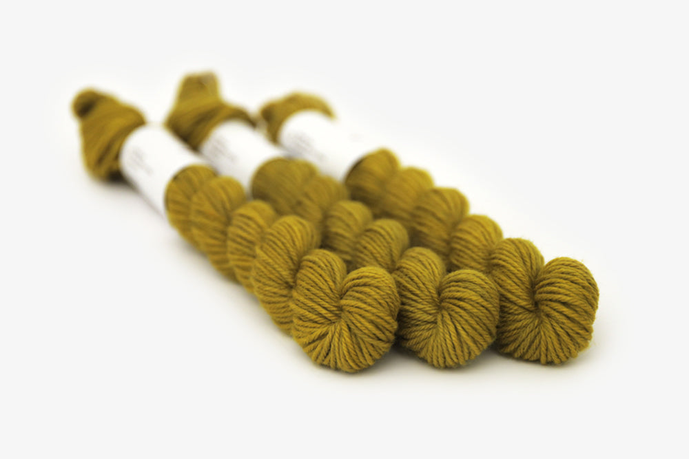 semisolid hand dyed caper (olive yellow green) dk mini yarn