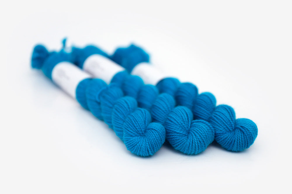 semisolid hand dyed cerulean (bright aqua blue) merino sock mini yarn