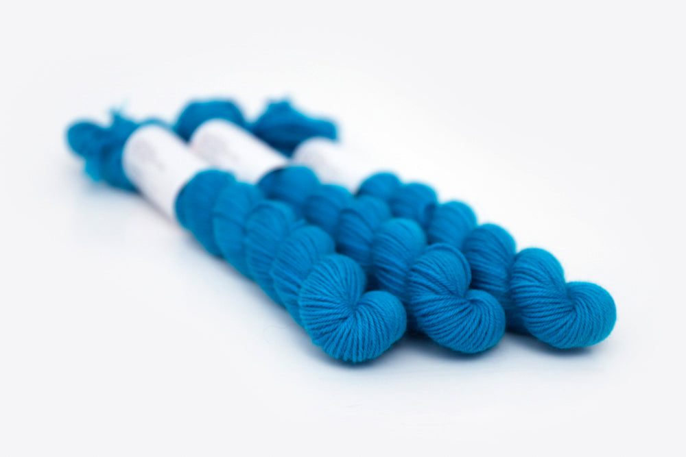 semisolid hand dyed cerulean (bright aqua blue) phyllis sock mini yarn