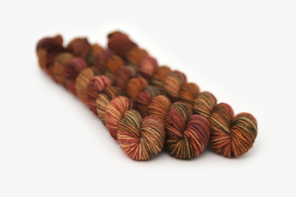 semisolid hand dyed rust red green orange dk mini yarn