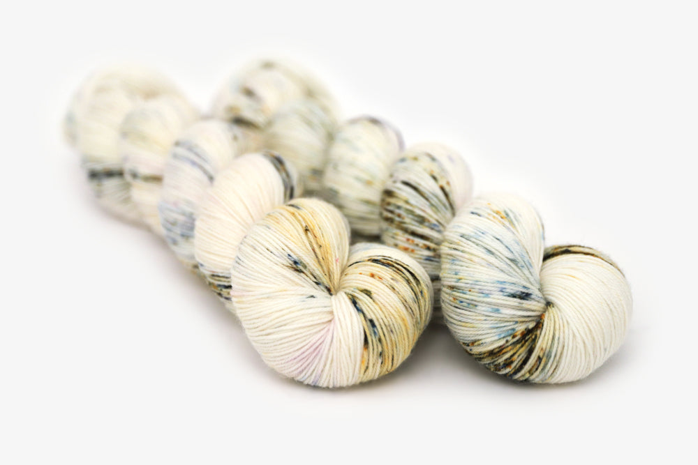 speckled hand dyed white olive yellow blue phyllis sock yarn