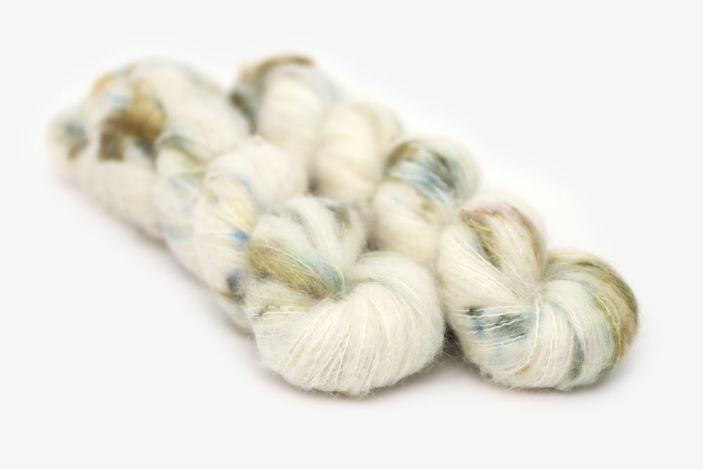 speckled hand dyed white olive yellow blue alpaca suri lace yarn