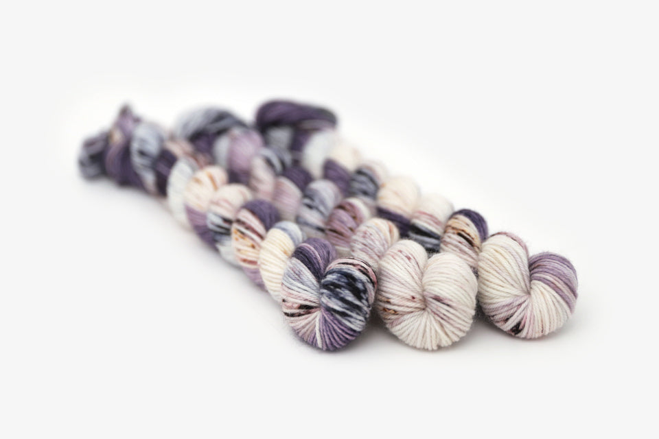 speckled hand dyed dark purple lilac white phyllis sock mini yarn