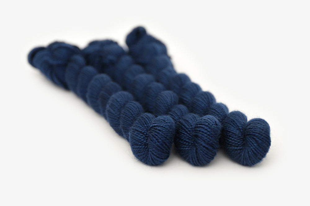 semisolid hand dyed lapis (dark indigo blue) merino sock mini yarn