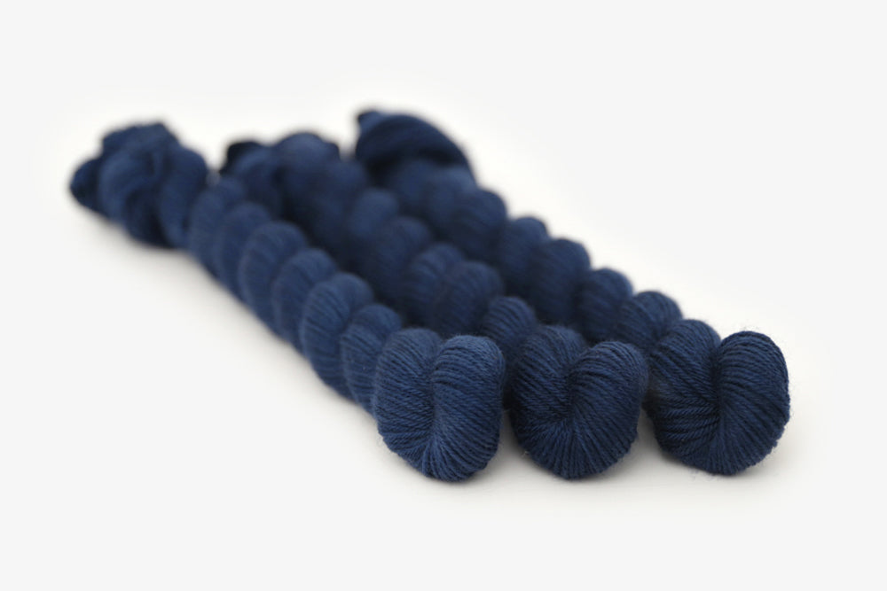 semisolid hand dyed lapis (dark indigo blue) phyllis sock mini yarn