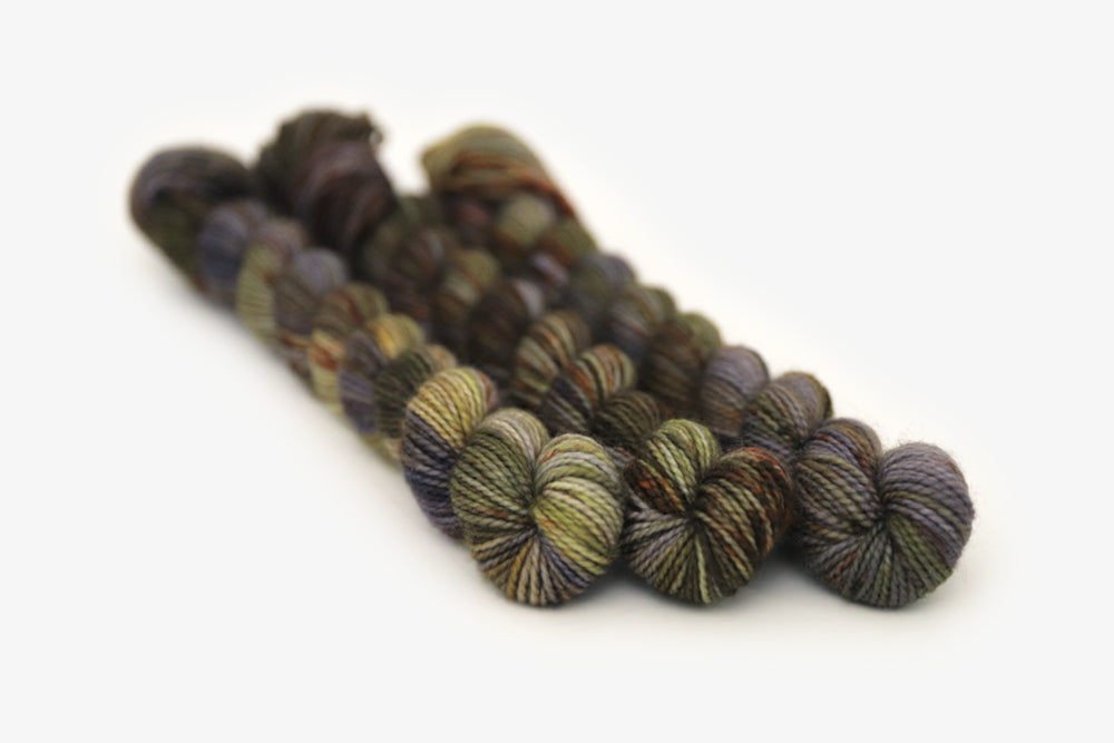 speckled hand dyed green olive dark gray brown merino sock mini yarn
