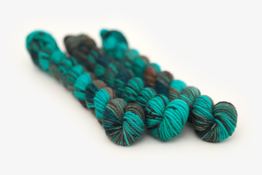 speckled hand dyed teal aqua dark purple dk mini yarn
