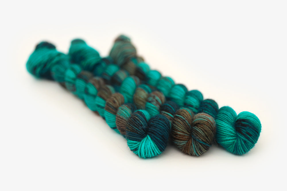 speckled hand dyed teal aqua dark purple phyllis sock mini yarn