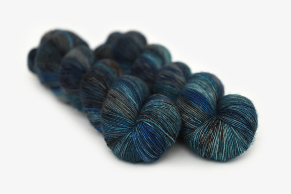 speckled hand dyed dark blue gray single sock yarn