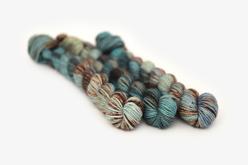 speckled hand dyed blue rust orange sage  merino sock mini yarn
