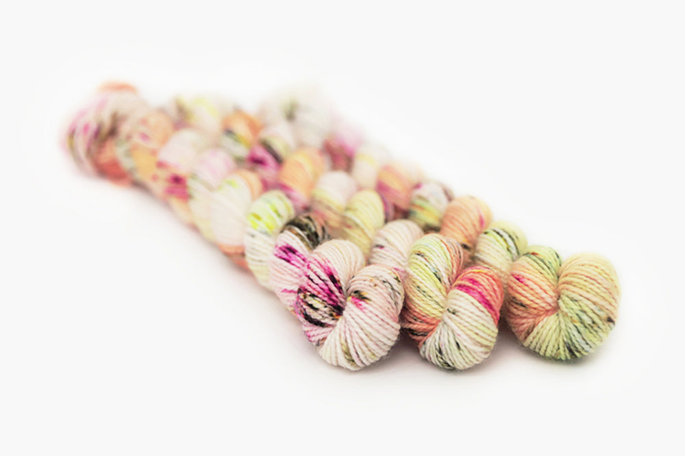 speckled hand dyed pink white neon yellow orange merino sock mini yarn