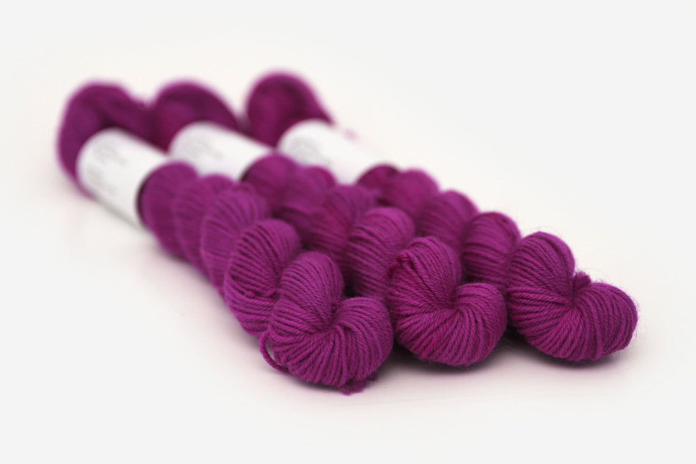semisolid hand dyed mulberry (magenta berry pink) phyllis sock mini yarn