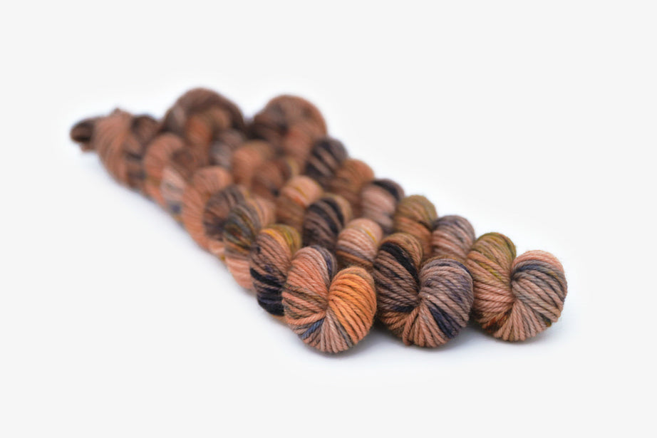 speckled hand dyed dusty pink yellow blue tan dk mini yarn