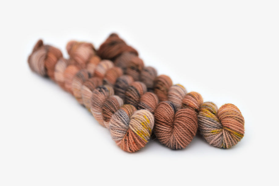 speckled hand dyed dusty pink yellow blue tan merino sock mini yarn