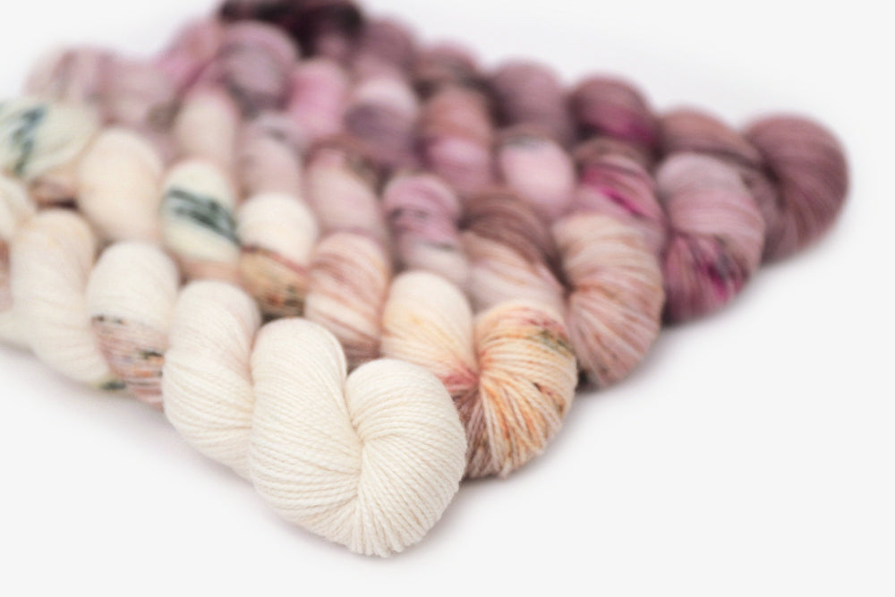 speckled hand dyed white pink dark mauve maroon brown yarn 50s set