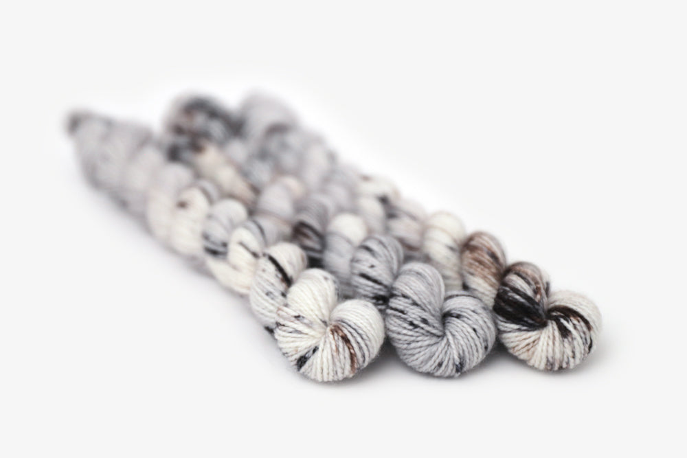 speckled hand dyed cool white gray brown merino sock mini yarn