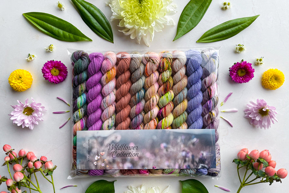 Wildflower yarn mini set surrounded by flowers and leaves