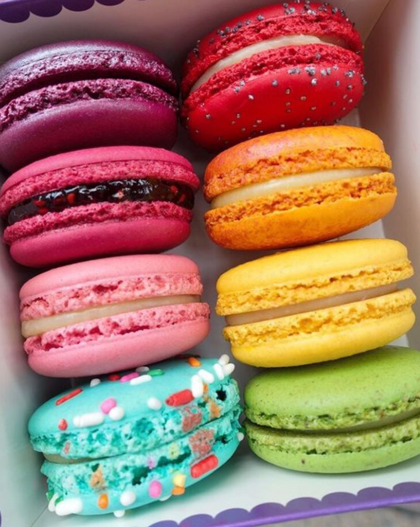 box of eight vibrantly colored macarons