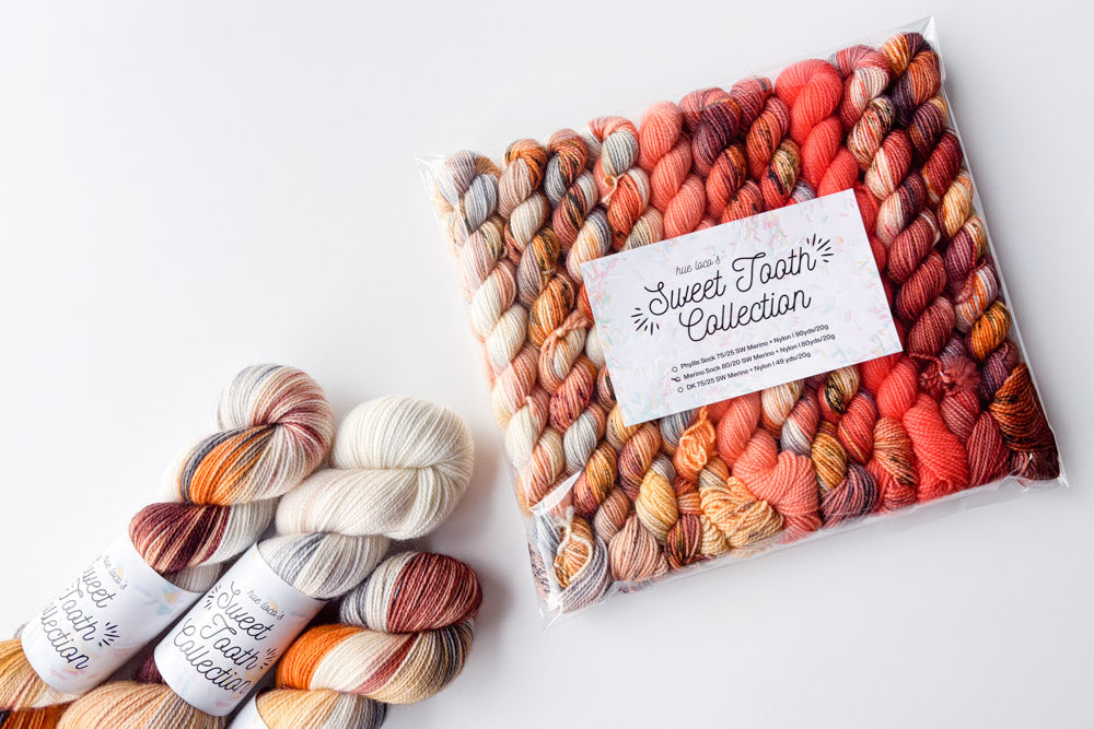 speckled semisolid hand dyed orange peach cream gray blue yarn and set