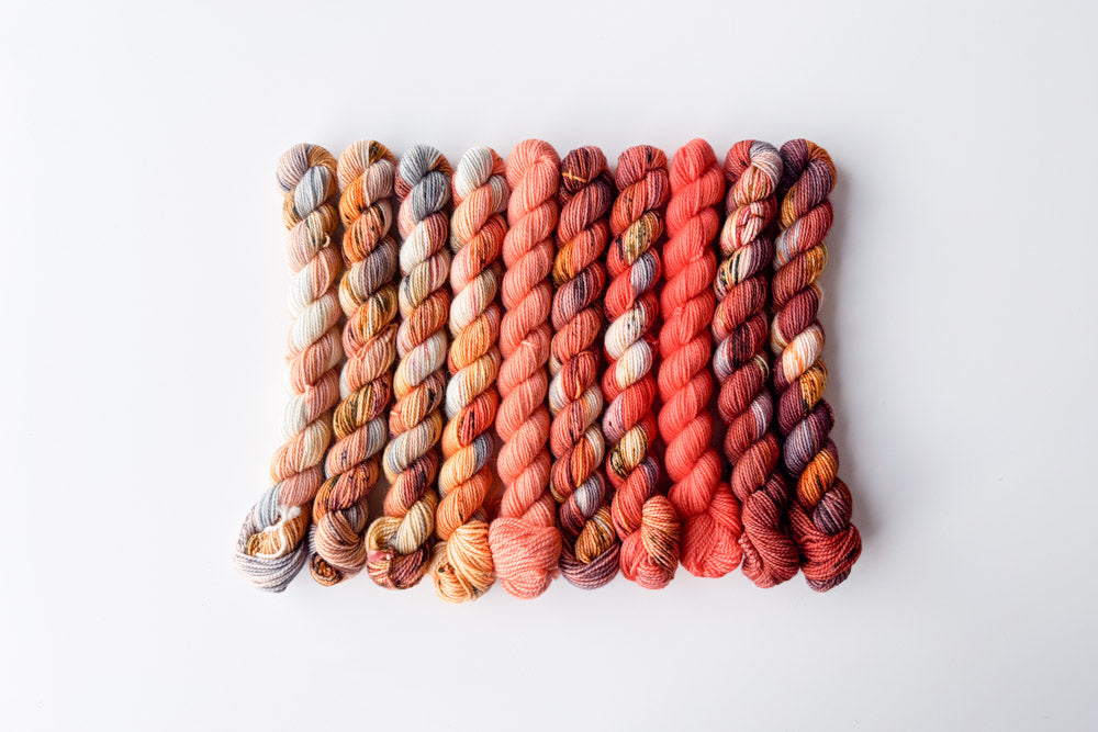 speckled semisolid hand dyed orange peach cream gray blue yarn set