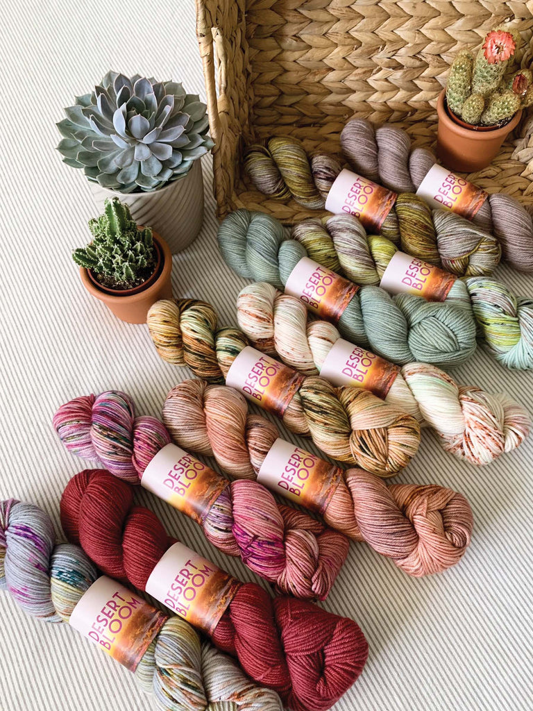 semisolid speckled hand dyed red pink tan teal green dk yarn skeins