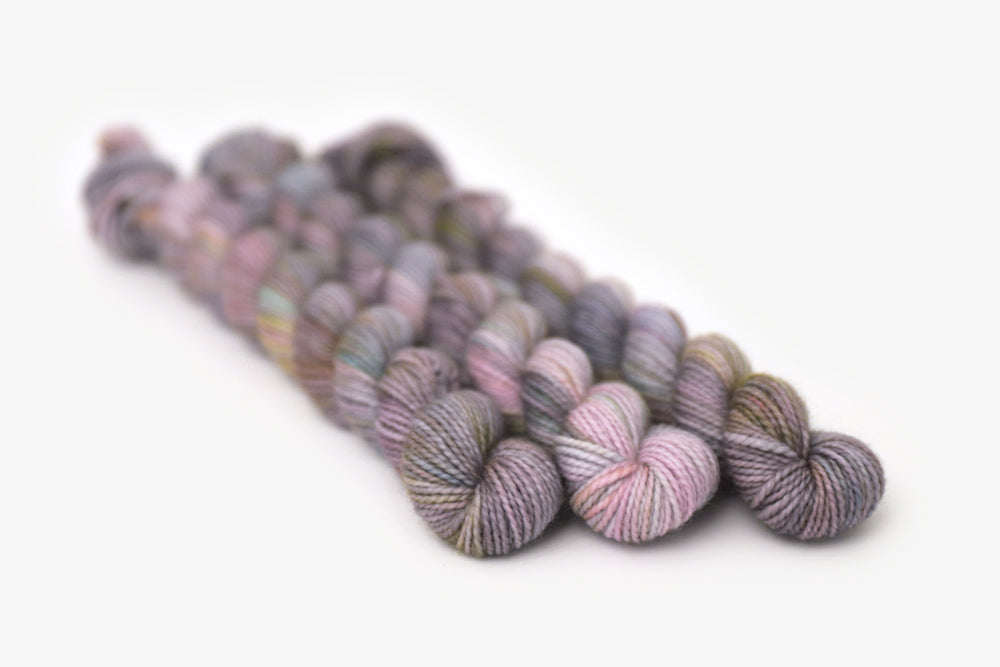 tonal hand dyed gray plum peach green blue merino sock mini yarn