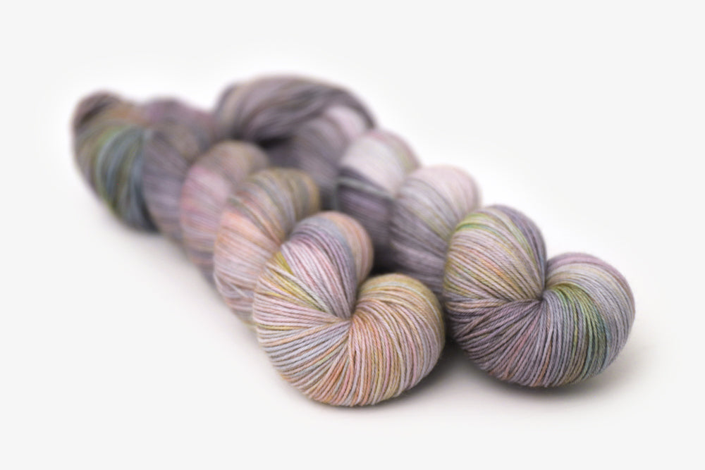 tonal hand dyed gray plum peach green blue phyllis sock yarn