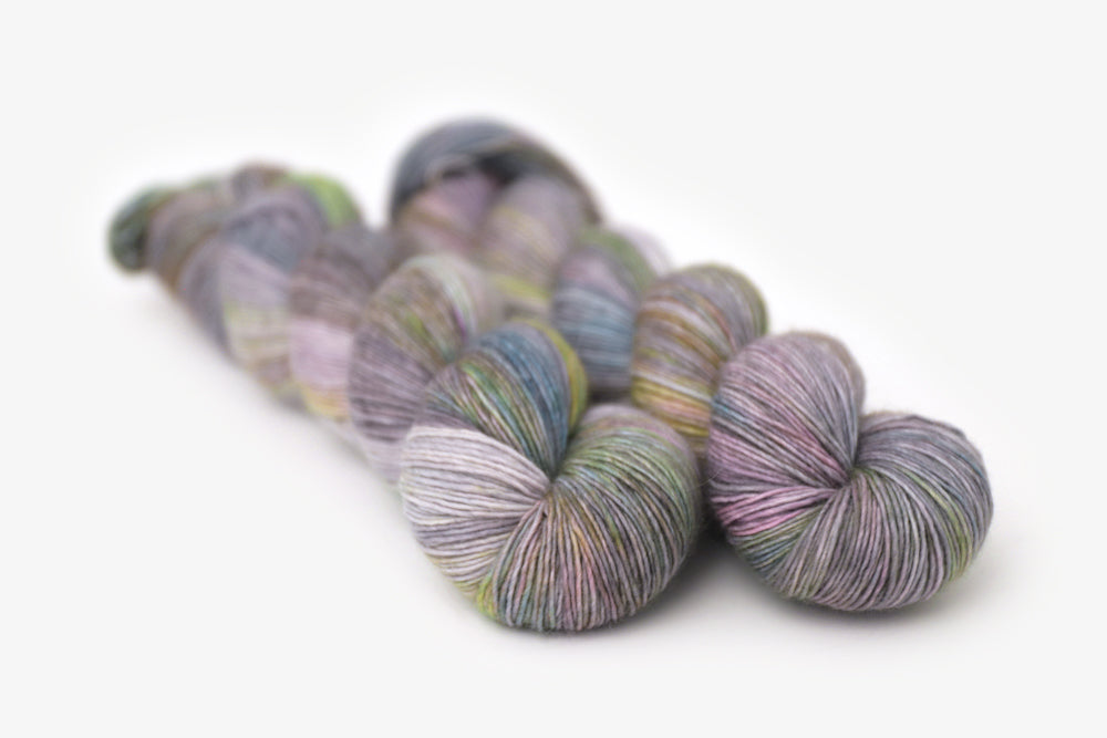 tonal hand dyed gray plum peach green blue single sock yarn