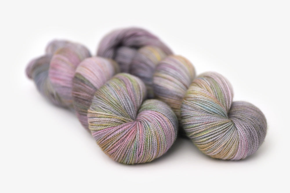 tonal hand dyed gray plum peach green blue spun sock xl yarn