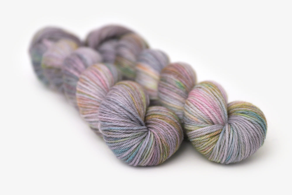 tonal hand dyed gray plum peach green blue worsted yarn
