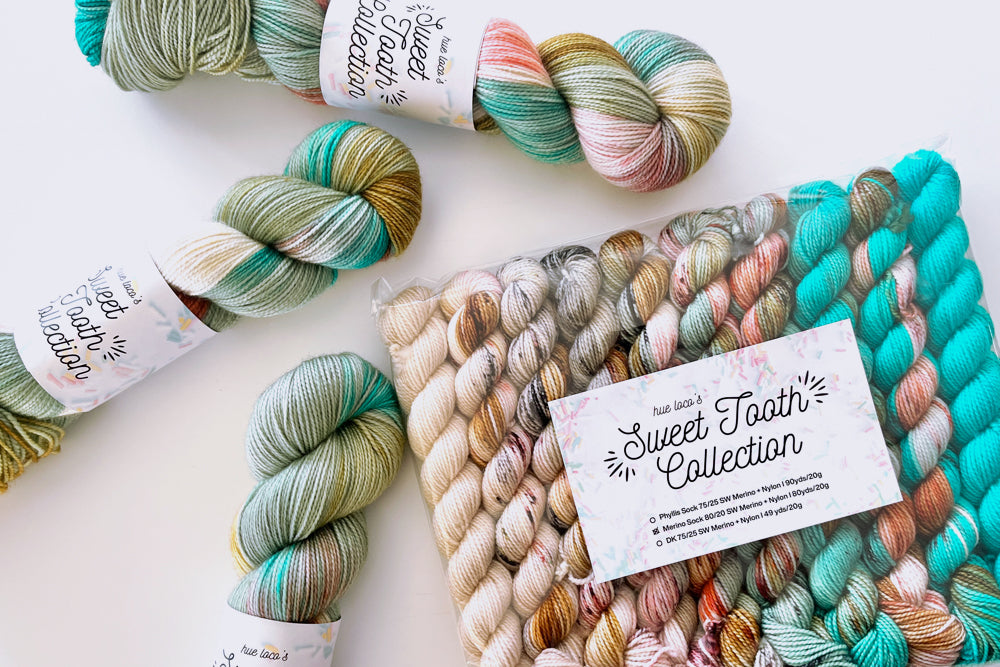 speckled semisolid hand dyed tan teal aqua red yarn and set