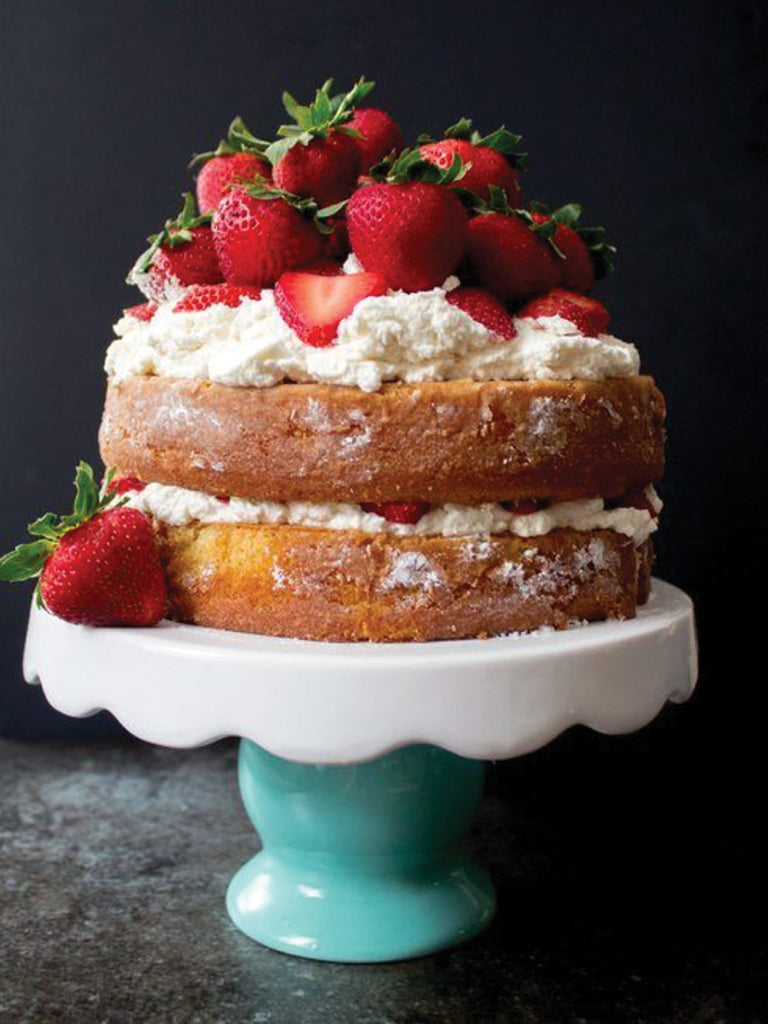 strawberry shortcake with whipped cream on ceramic
