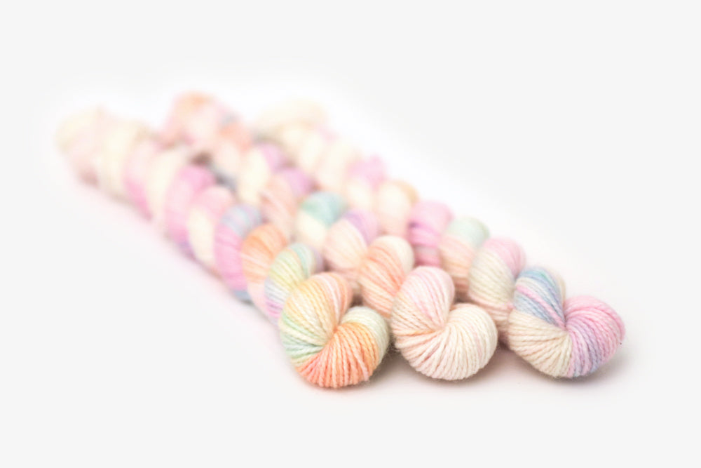 tonal hand dyed white pink plum peach green merino sock mini yarn