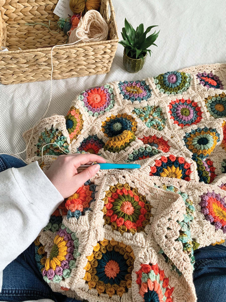 blanket set being crocheted with semisolid speckled hand dyed colors of dk yarn