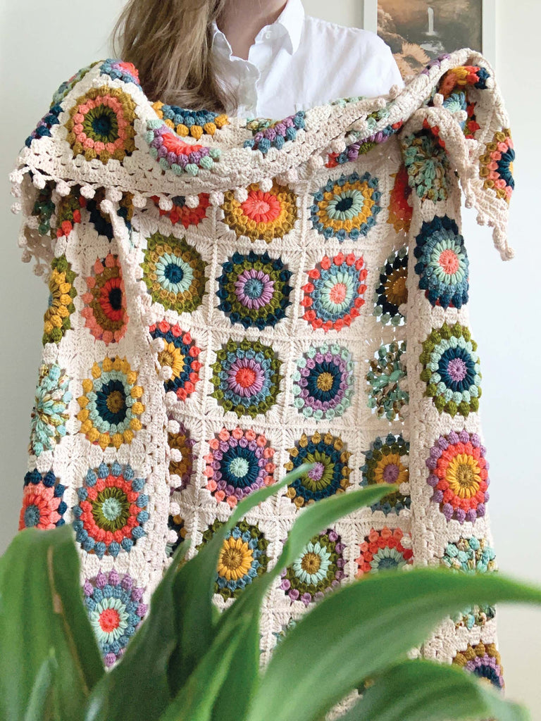 blanket made out of semisolid speckled hand dyed colors of dk yarn
