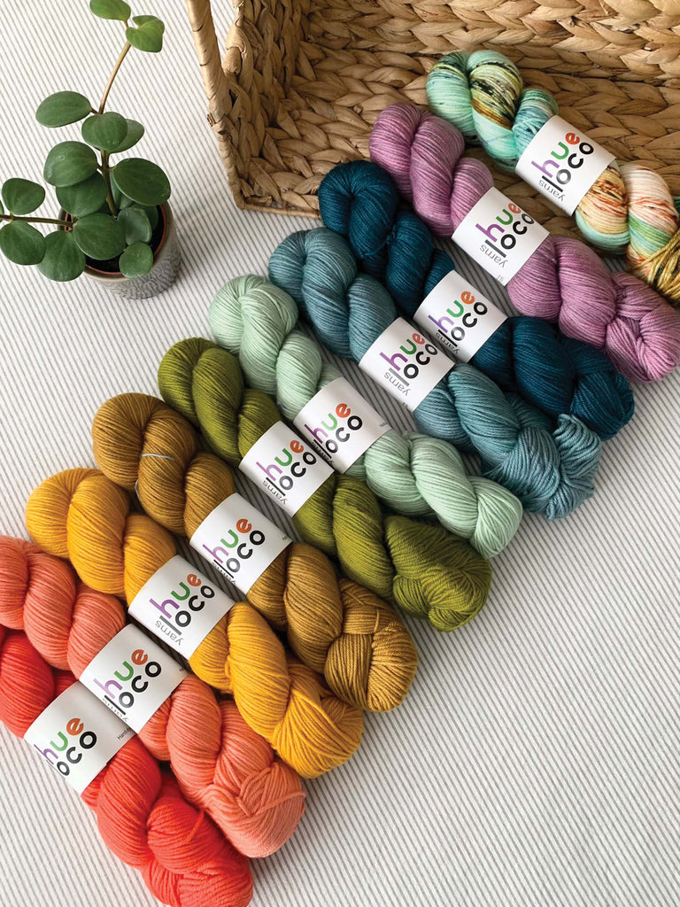 semisolid speckled hand dyed orange yellow green teal purple dk yarn skeins