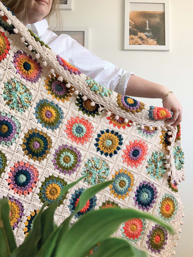 blanket made out of semisolid speckled hand dyed colors of dk yarn
