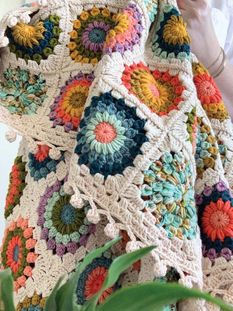 blanket made out of semisolid speckled hand dyed colors of dk yarn