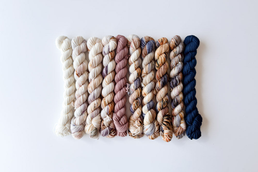 speckled semisolid hand dyed white tan purple brown blue yarn set