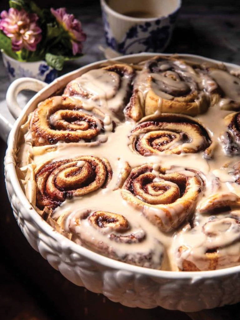 cinnamon rolls in white ceramic dish 