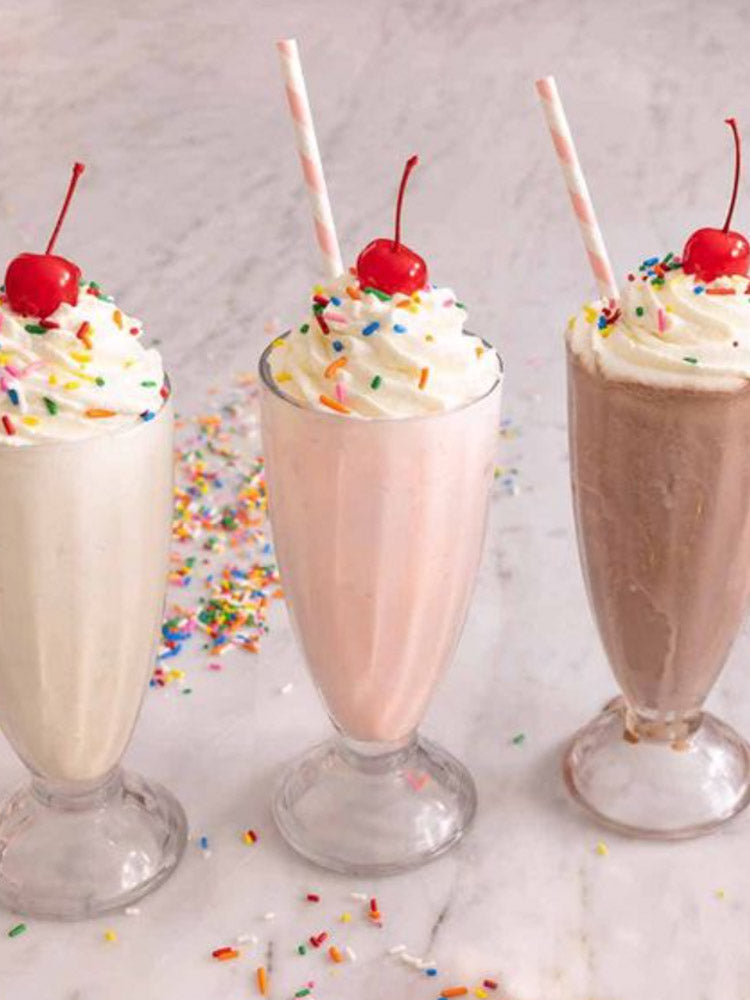 three milkshakes vanilla strawberry and chocolate