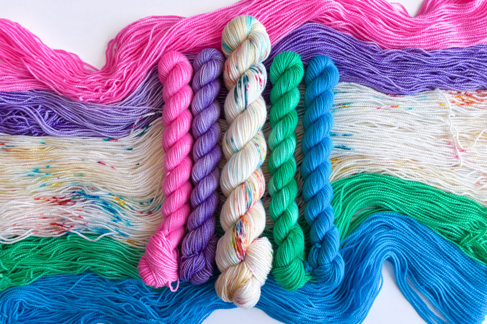 speckled semisolid hand dyed white pink green blue yarn set