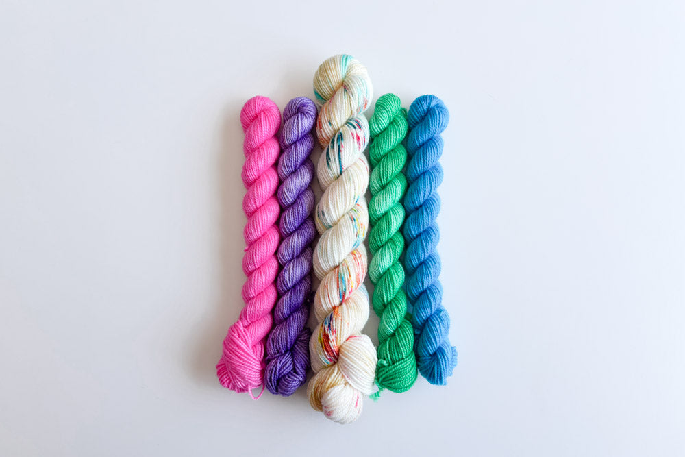 speckled semisolid hand dyed white pink green blue yarn set