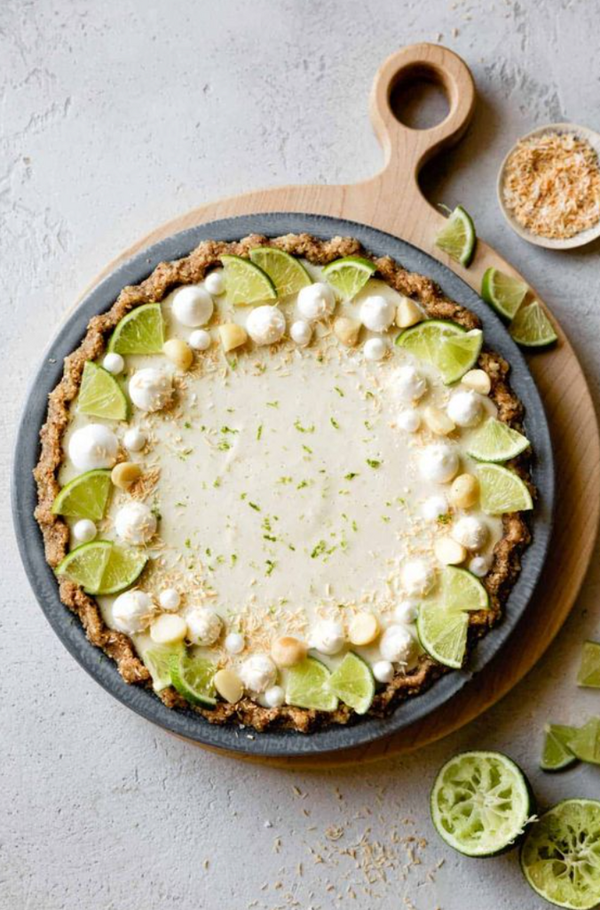 key lime pie on wooden serving board