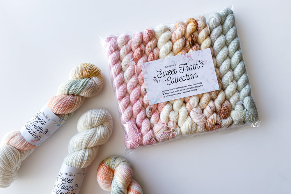 speckled semisolid hand dyed pale pink white tan beige blue yarn and set