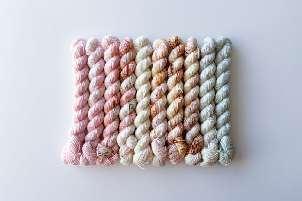 speckled semisolid hand dyed pale pink white tan beige blue yarn set