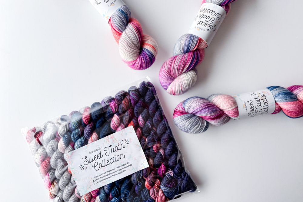speckled semisolid hand dyed gray fuchsia blue purple yarn and set 