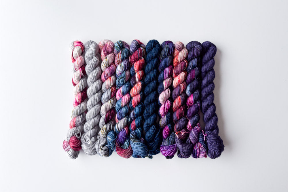 speckled semisolid hand dyed gray fuchsia blue purple yarn set 