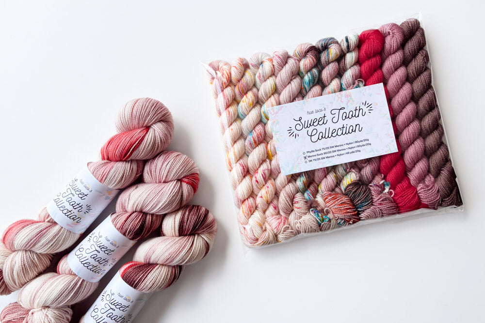 speckled semisolid hand dyed peach aqua fuchsia brown purple yarn and set